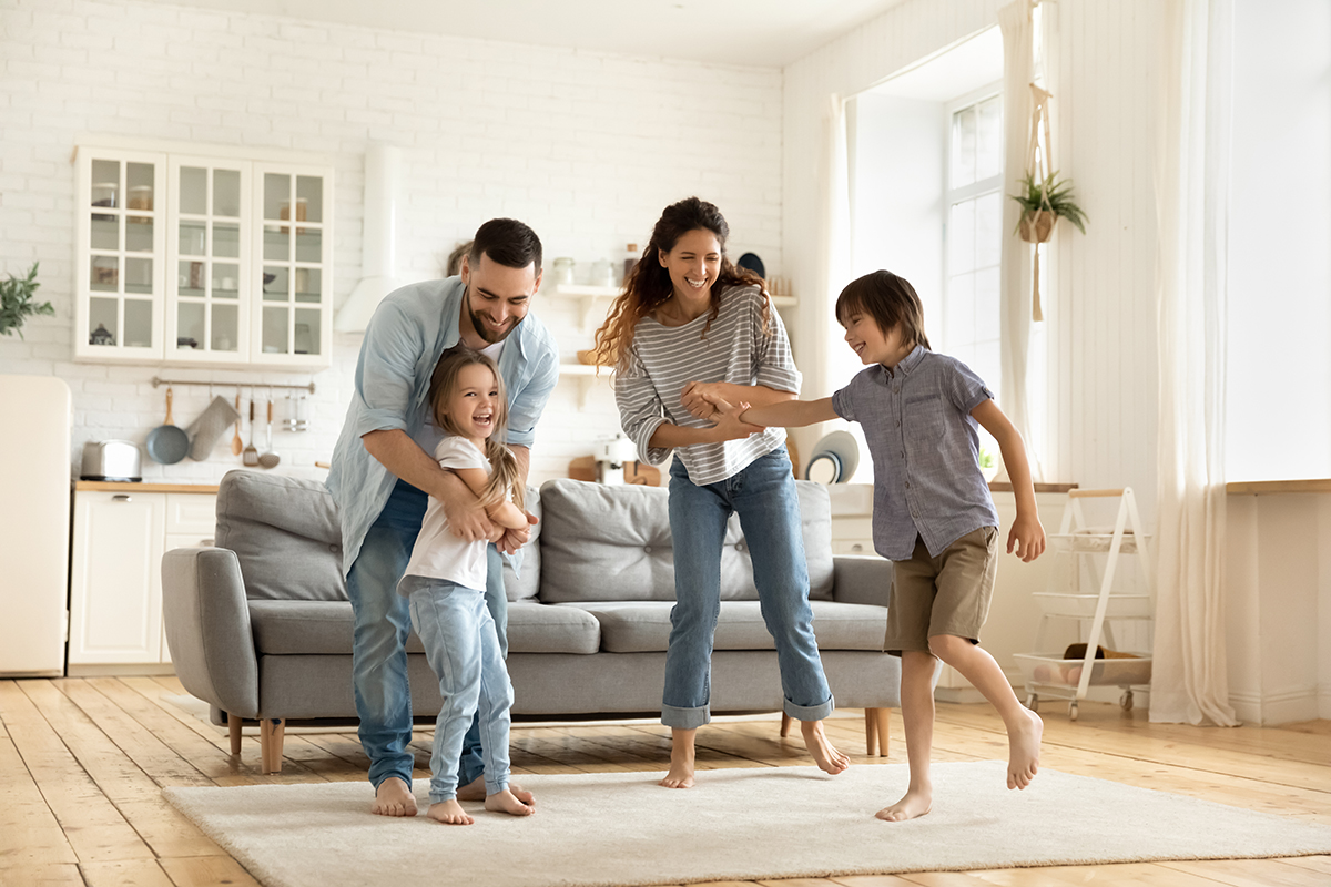 Happy family enjoying their clean and organized home in Newburyport Massachusetts after Perfect Touch cleaning service